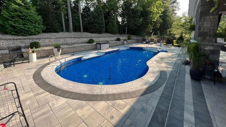 Beautiful pool surrounded by stamped patio