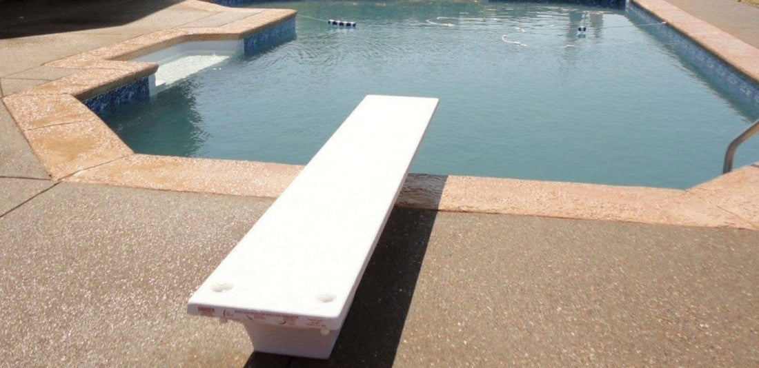 Shot of diving board addition being added to custom in ground pool